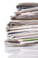 Stack of newspapers on white background