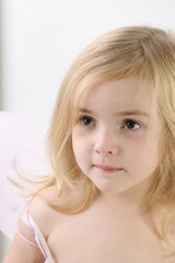 little girl with fairy wings -  over white