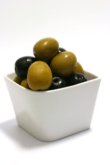 Black and green olives in vase