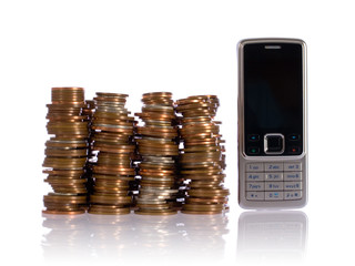 pile of UK coins against mobile phone