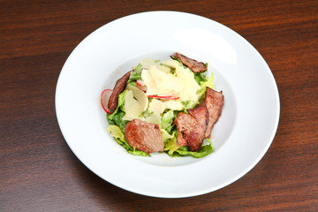 Beef salad with potato and walnut sauce