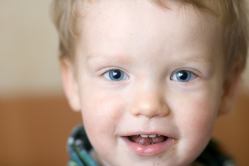 Small boy facial close - up portret with chocolate (indoor) © wildman