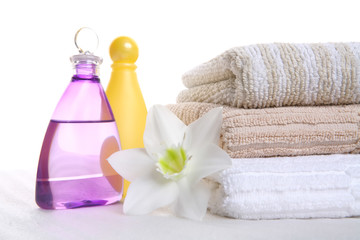 hygienic still-life, aromatic oil, shampoo and towel