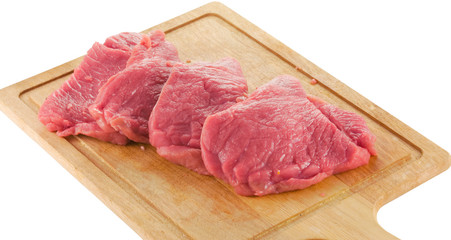 raw beef on wood board isolated on white background