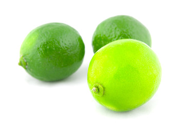 Fresh lime fruits isolated on white