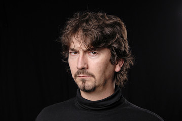 Obraz premium young casual man portrait in black background