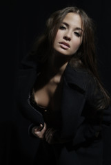 Fototapeta premium an attractive woman with long brown hair and coat