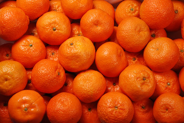 background of many bright tangerines