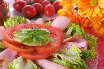 Fresh salad with onion, tomato and basil