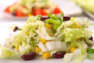 Fresh salad with corn and basil