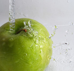 Green Apple Being Rinsed