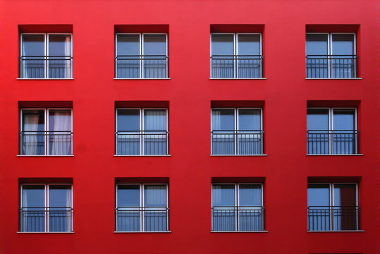 A red residential building facade in red