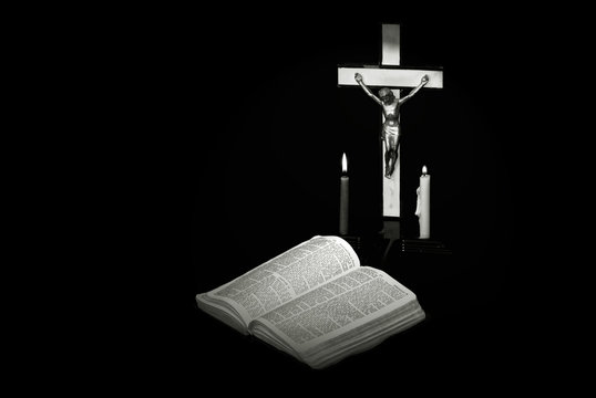 stark black and white image of a prayer crucifix