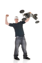 Handsome youngster, teenager posing with skateboard,  
