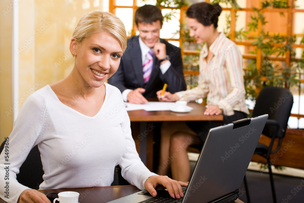 Wall mural Business woman sitting at the table  in a cafe