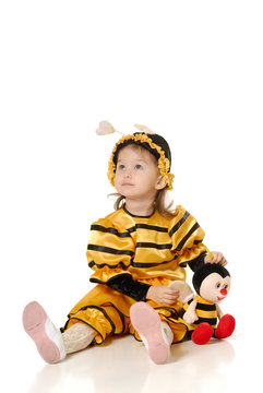 The little girl in dress of a bee