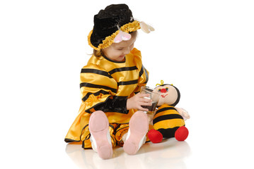 The little girl with a honey glass