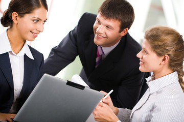 Three  white collar worker interacting at business meeting