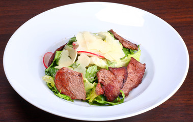 Fototapeta na wymiar Beef salad with potato and walnut sauce
