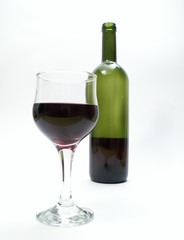 Bottle of red wine and wineglass on white background