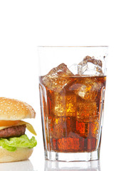Cheeseburger and soda glass
