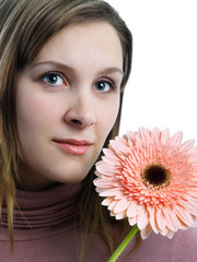 Beautiful girl with african daisy on white background