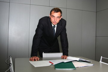 The man behind a table with documents