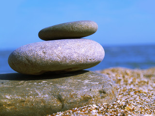 cool stone on the beach on blue sky background