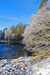 A river in Sweden surrounded by snow