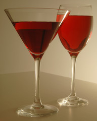 Two glasses with red liquid