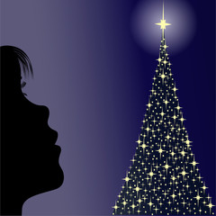 niñita mirando arbol de estrellas