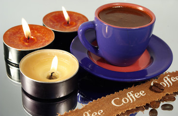cup of black hot coffee and candles