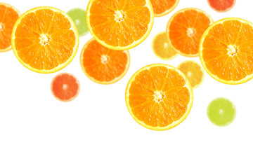 Juicy orange and lemon slices falling down, isolated in white