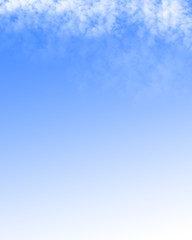 Clouds in a clear blue sky with room for copy