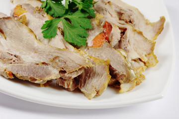 Pieces of  ham on the plate with parsley