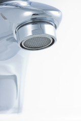 Metallic faucet with sprinkler