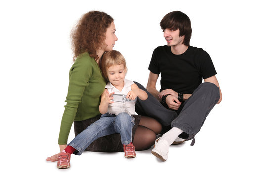 Father And Mother And Daughter With Cell Phone On White