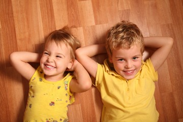 two children lie on the floor 3