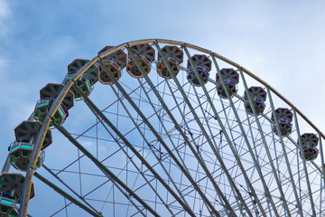 Ferris Wheel against cloudy blue sky (detail)