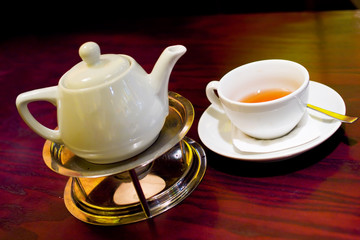 set of tepot and cup in wam cafe light