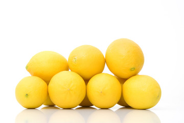 group of fresh lemons isolated against white background