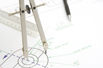 drawing circle with a compass on a blueprint