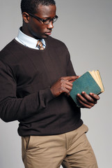 Young African American Male Reading Book