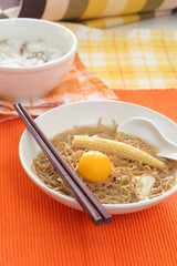 Brown Chinese buckwheat noodles with egg and baby corn 