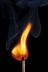 close up macro of a match on fire