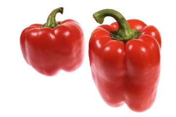 two red paprikas isolated on white background