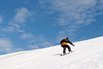 Naklejka na ściany i meble Snowboarder rozpryskiwania śniegu