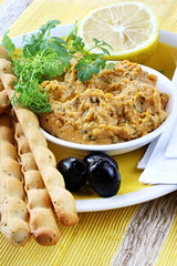 Hummus dip served with lemon, cilantro or coriander