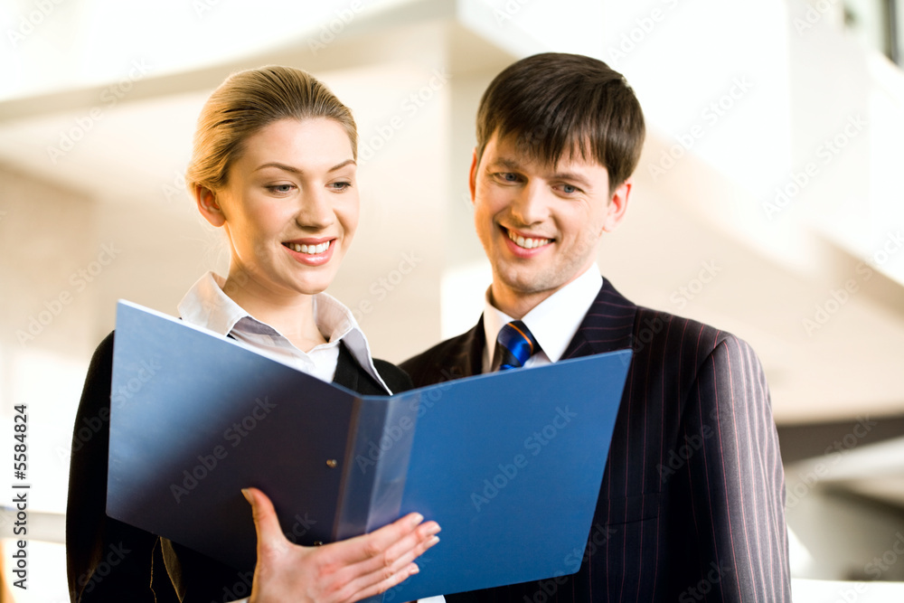 Wall mural Portrait of two successful people discussing a plan at meeting