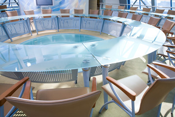 Conference room: chairs around a large glassy table